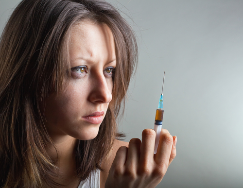 Young Woman With Drug Addiction On Dark Background