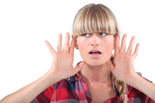 Blond Woman Touching Ears